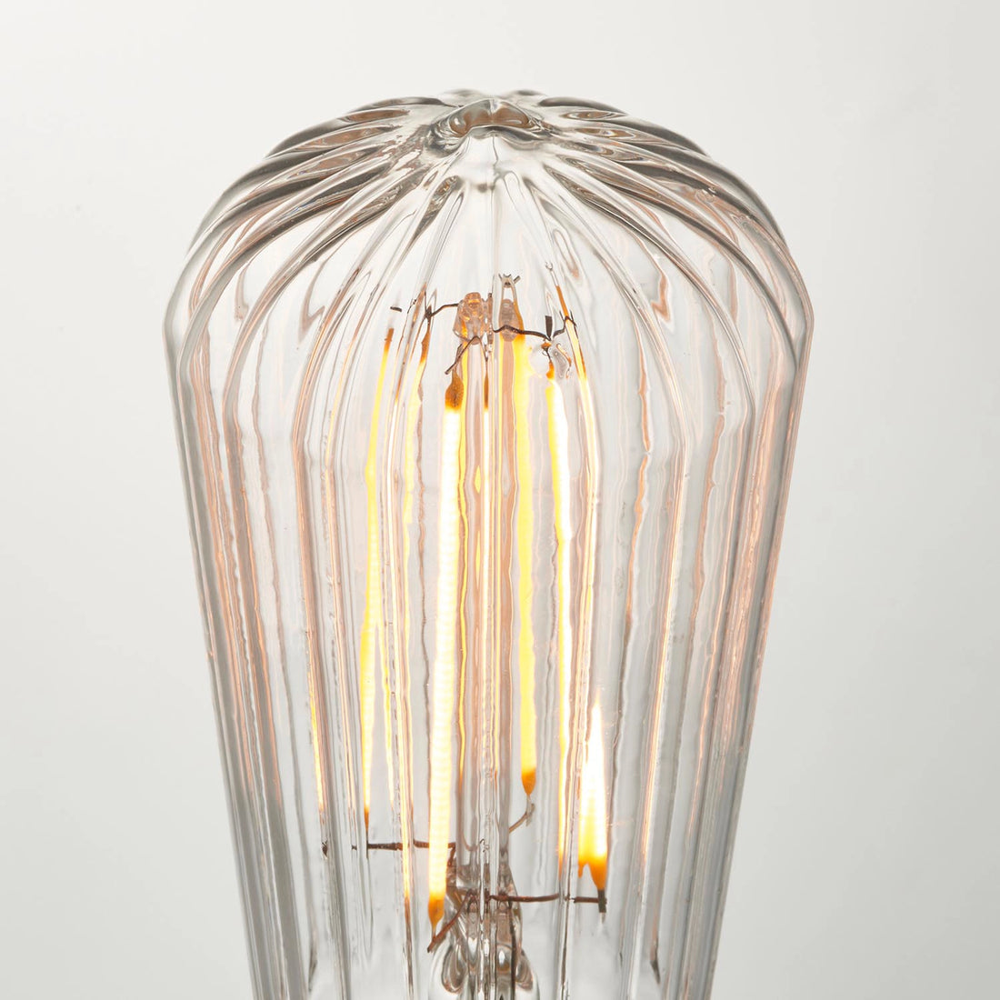 How Ember Ribbed Pear E27 LED Bulb — Anti-Glare, Ultra Warm 2000K lights a room