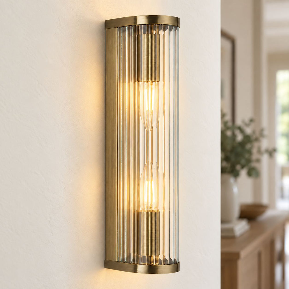 Halo 2-Light Ribbed Wall Sconce — Glass, Antique Brass after dark