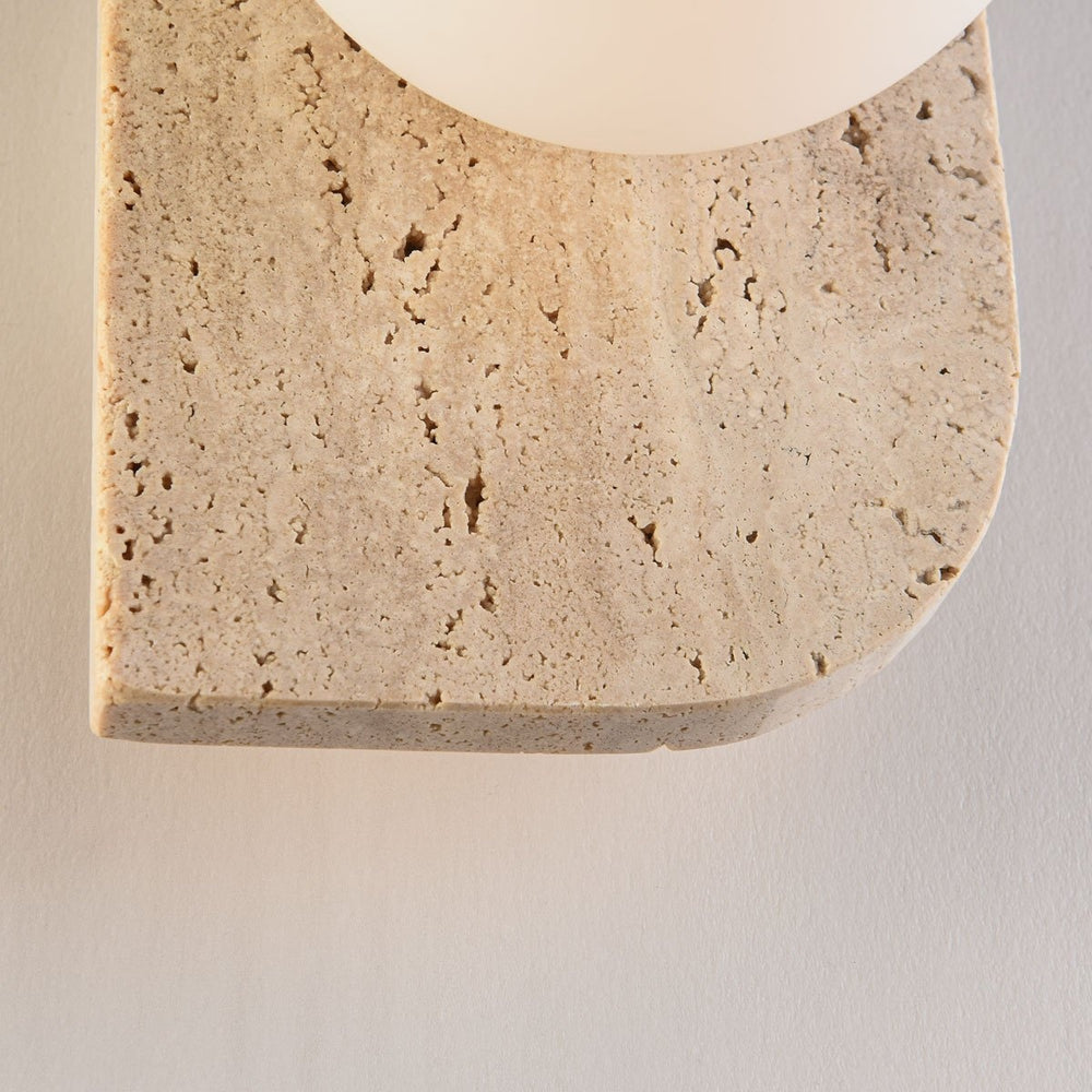 Orla Travertine Globe Wall Light — Single after dark