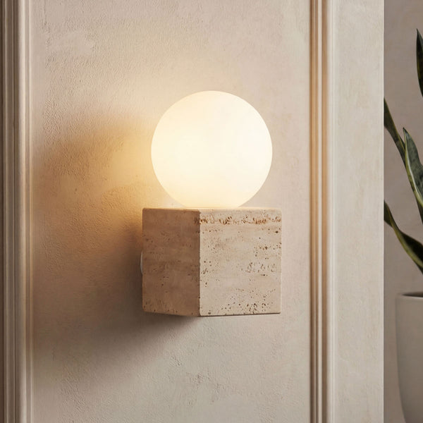 Isla sand beige travertine wall light with opal globe