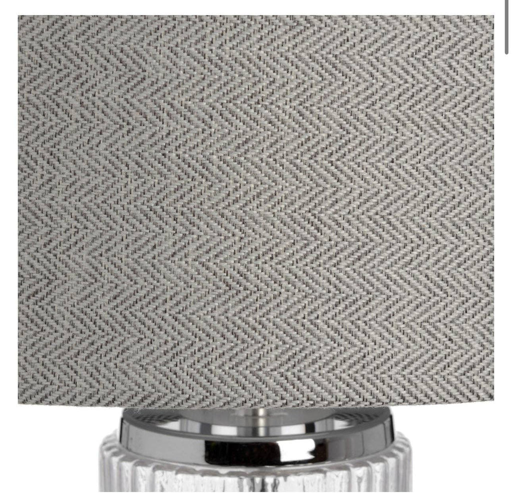 Roma table lamp illuminated showing fluted glass base and warm ambient lighting