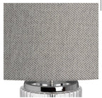 Roma table lamp illuminated showing fluted glass base and warm ambient lighting