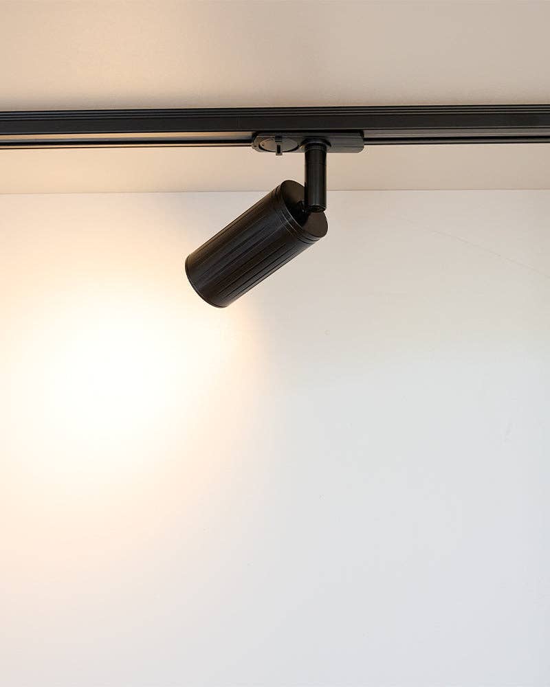 Black track spotlight in modern living room interior UK