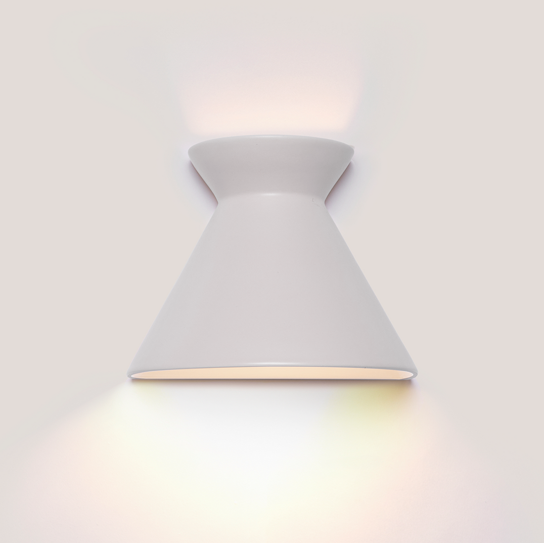 Kiro small pure white ceramic wall light casting light up and down