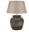 Castello aged stone table lamp with hand-painted finish on side table