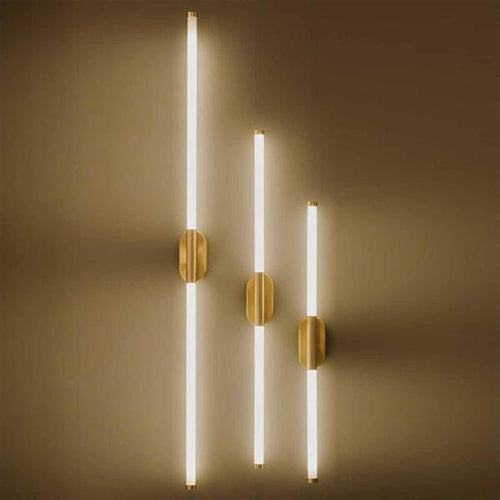 Close-up of Akra wall light showing warm LED glow through plexiglass surface