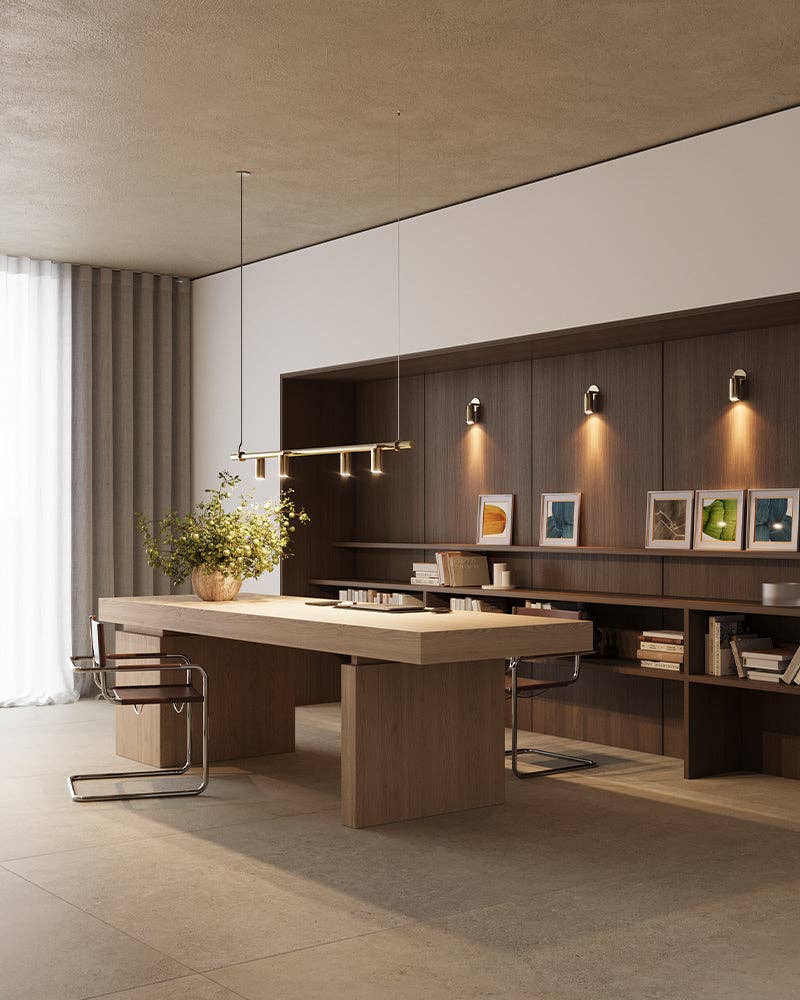 Wall spotlight illuminating artwork creating warm downlight effect