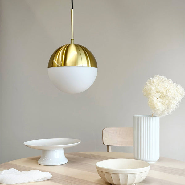 Selene spherical pendant light with opal glass shade and brass fitting