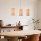 Close-up of Liora pendant light showing beige linen fabric shade detail