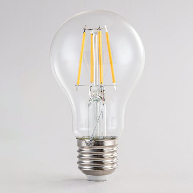 Dimmable LED filament bulb close-up showing vintage-style filament design