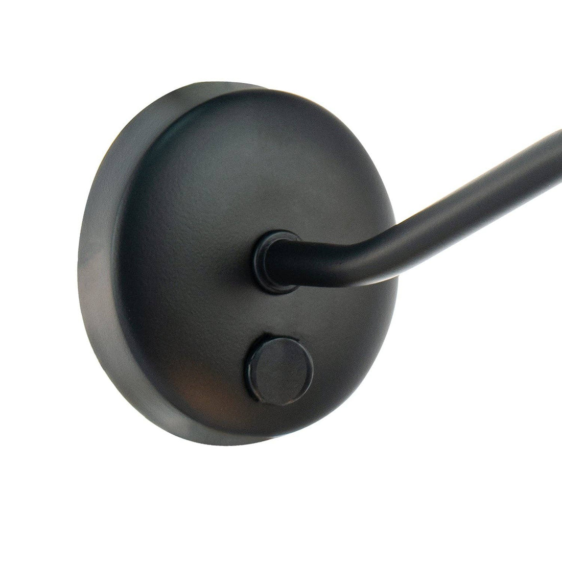 Matt black wall-mounted picture light positioned above painting in modern gallery wall