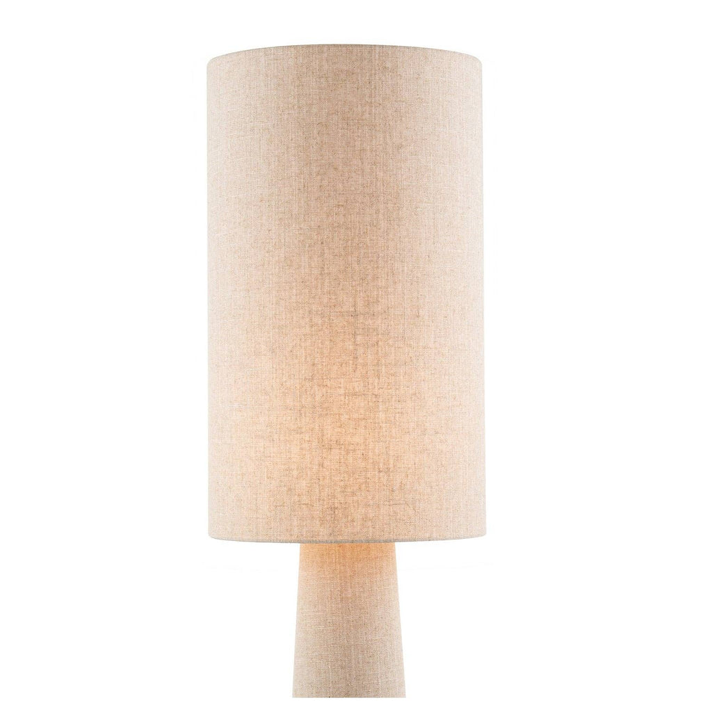 Oatmeal fabric floor lamp illuminated showing warm ambient uplighting effect