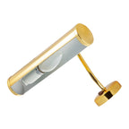 Swan neck wall light illuminating gallery wall with warm focused beam