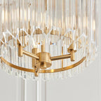 Close up of Coltrane pendant light showing gold metalwork and glass shade detail