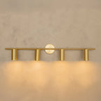 Koza antique brass wall sconce mounted on white wall