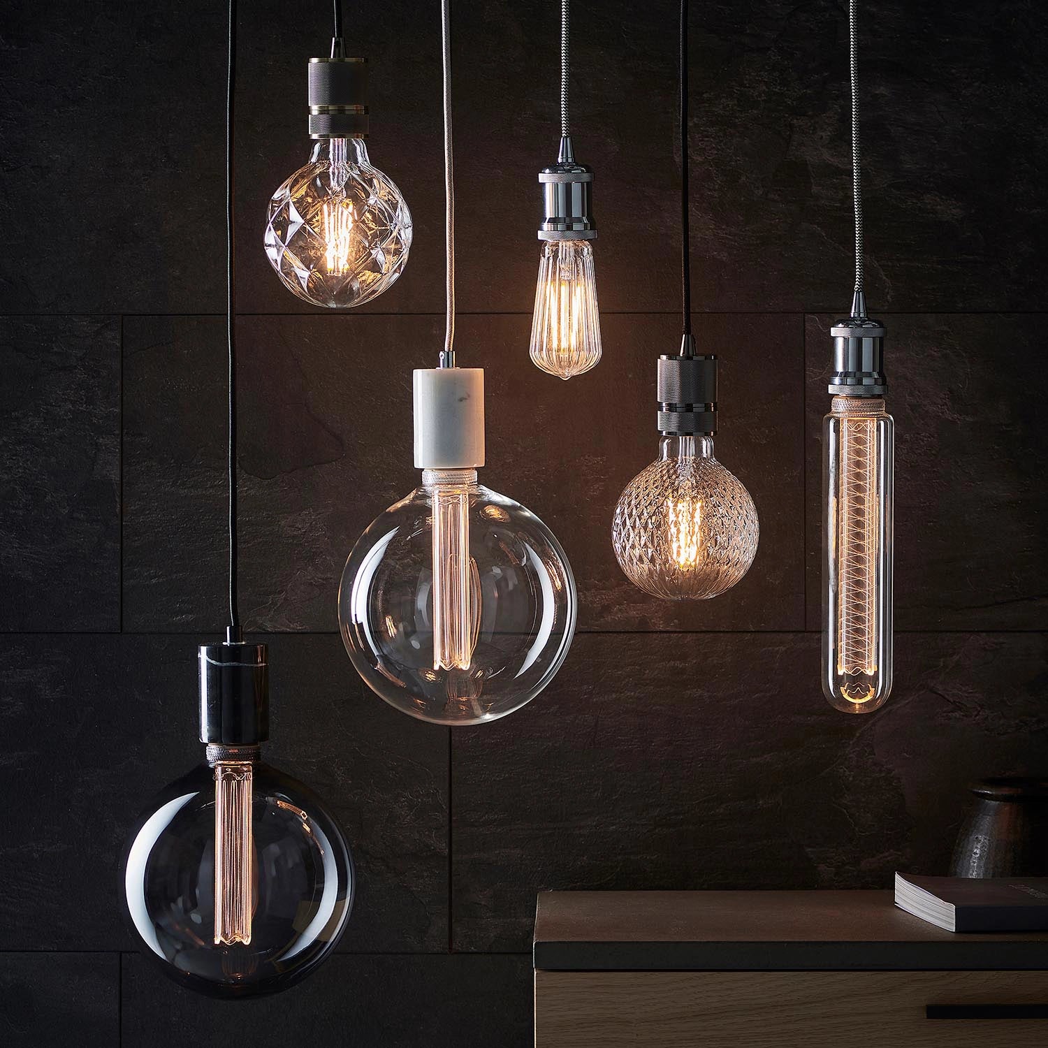 Anti-glare ribbed glass design of Ember pear shaped LED light bulb