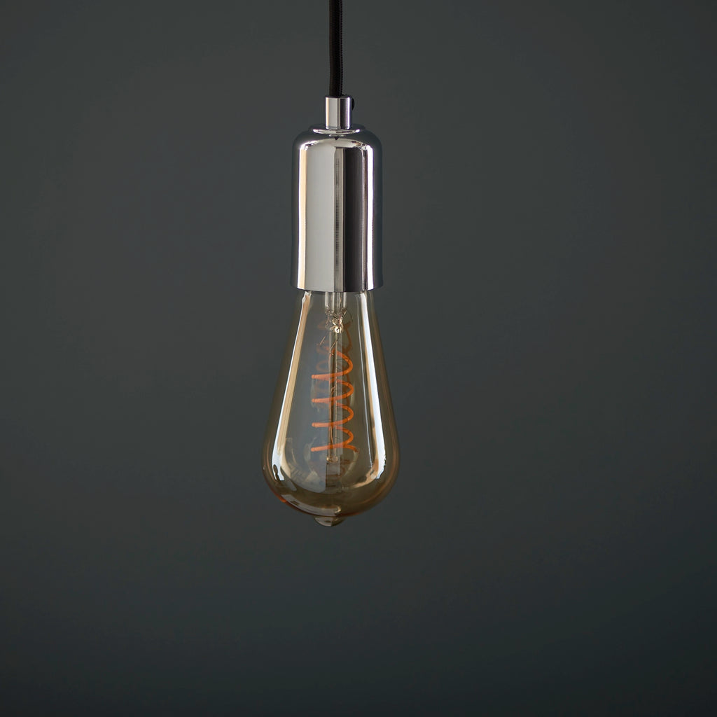 Dimmable amber LED bulb showing warm golden glow when illuminated