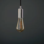 Dimmable amber LED bulb showing warm golden glow when illuminated