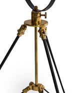 Valen tripod table lamp illuminated in modern living room setting