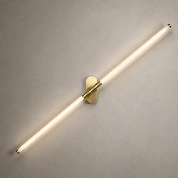 Akra 60cm LED tube wall light angled diagonally on an antiqued brass mount