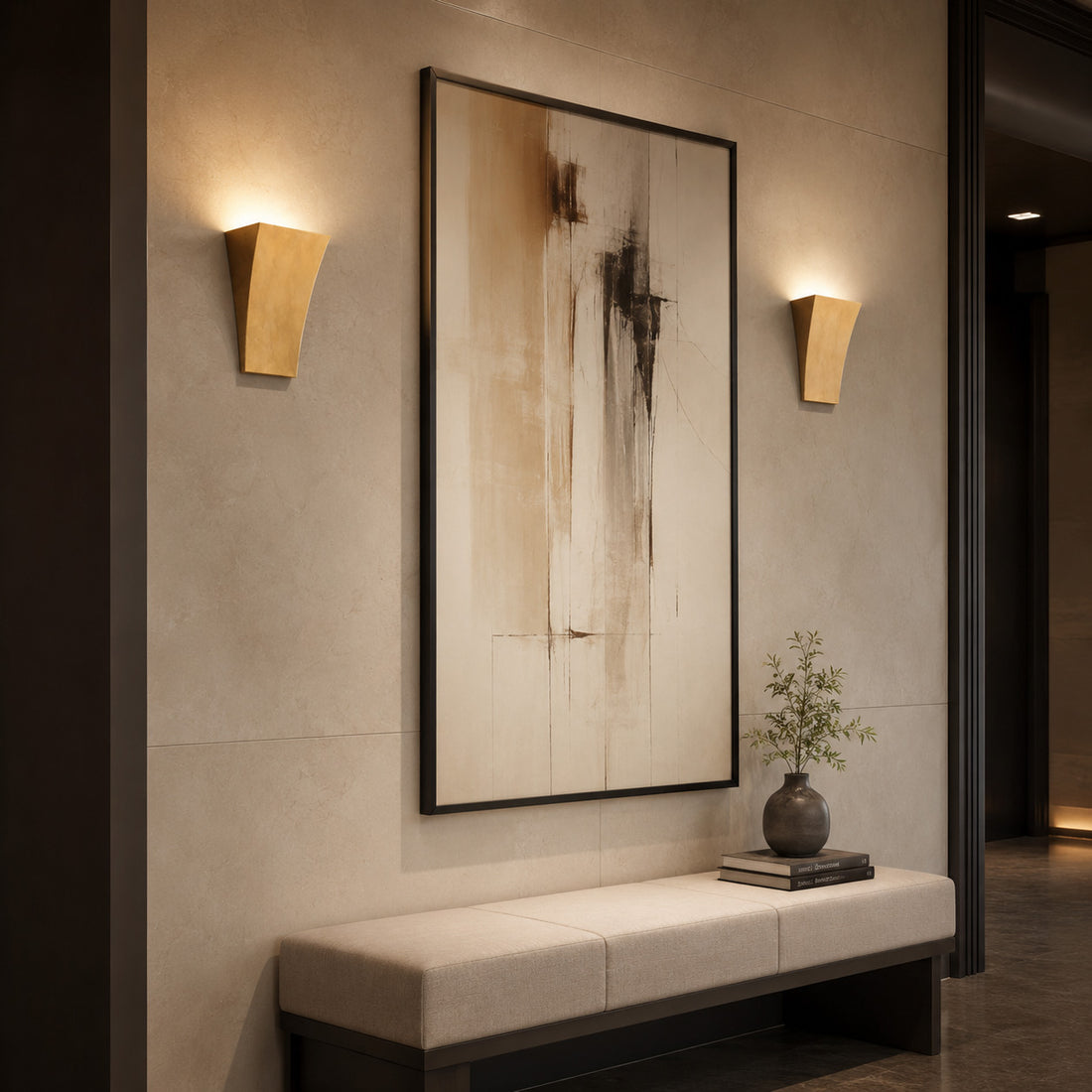 Alma gold uplighters glowing beside large art in a hotel-style hallway