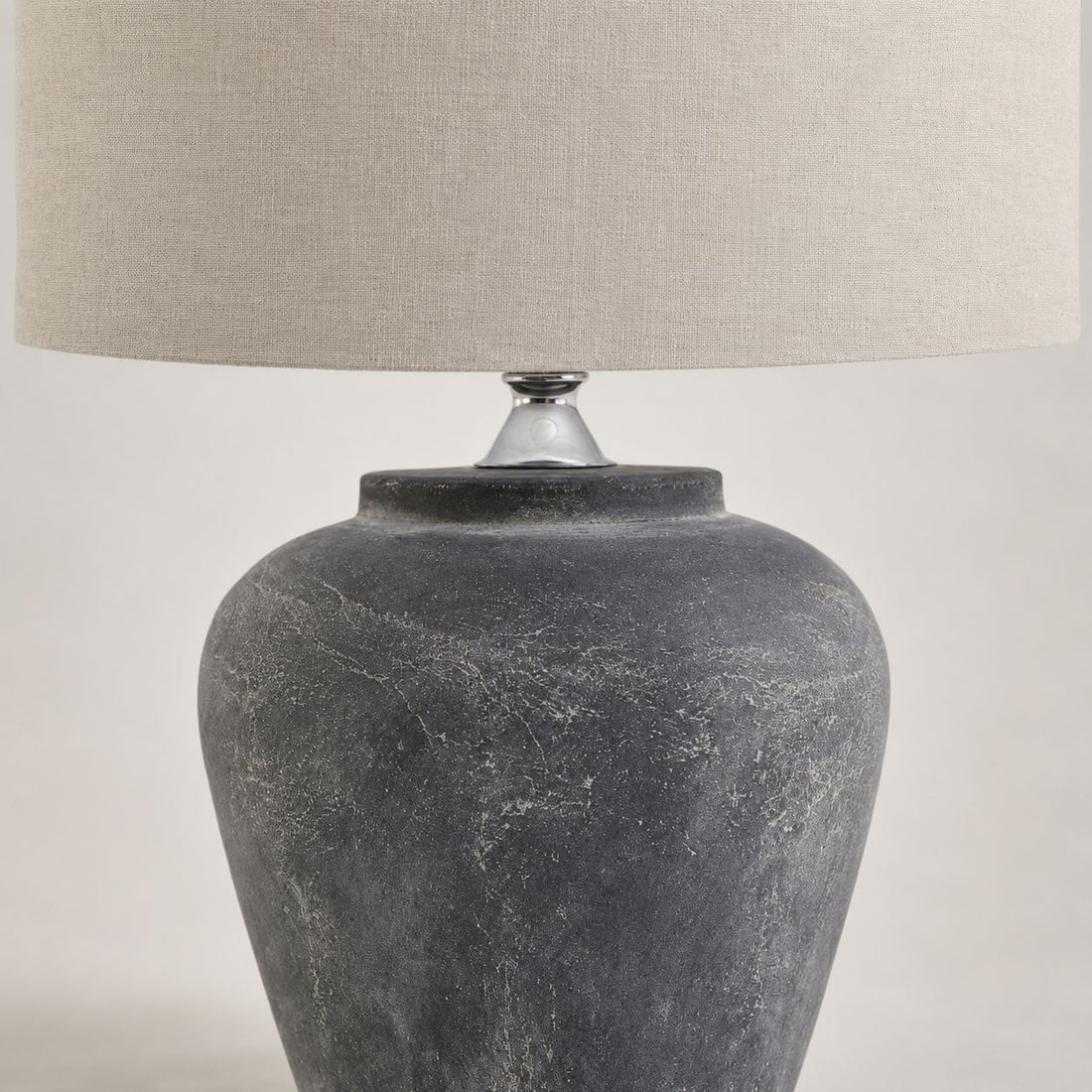 Amalfi table lamp, close-up of the charcoal grey textured stone base
