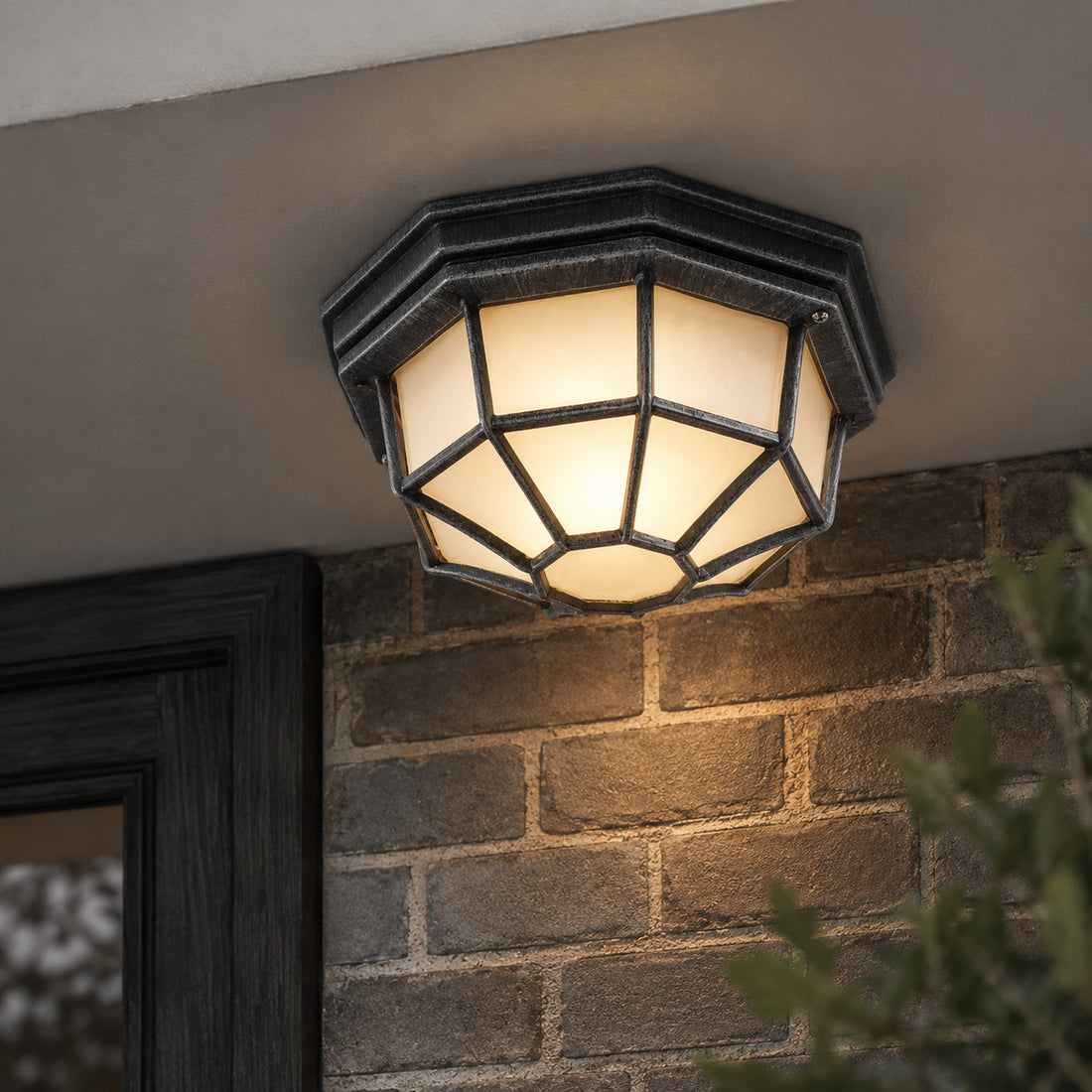 How Corvus Hexagonal Outdoor Lantern — Glass, Brushed Black/Silver lights a room