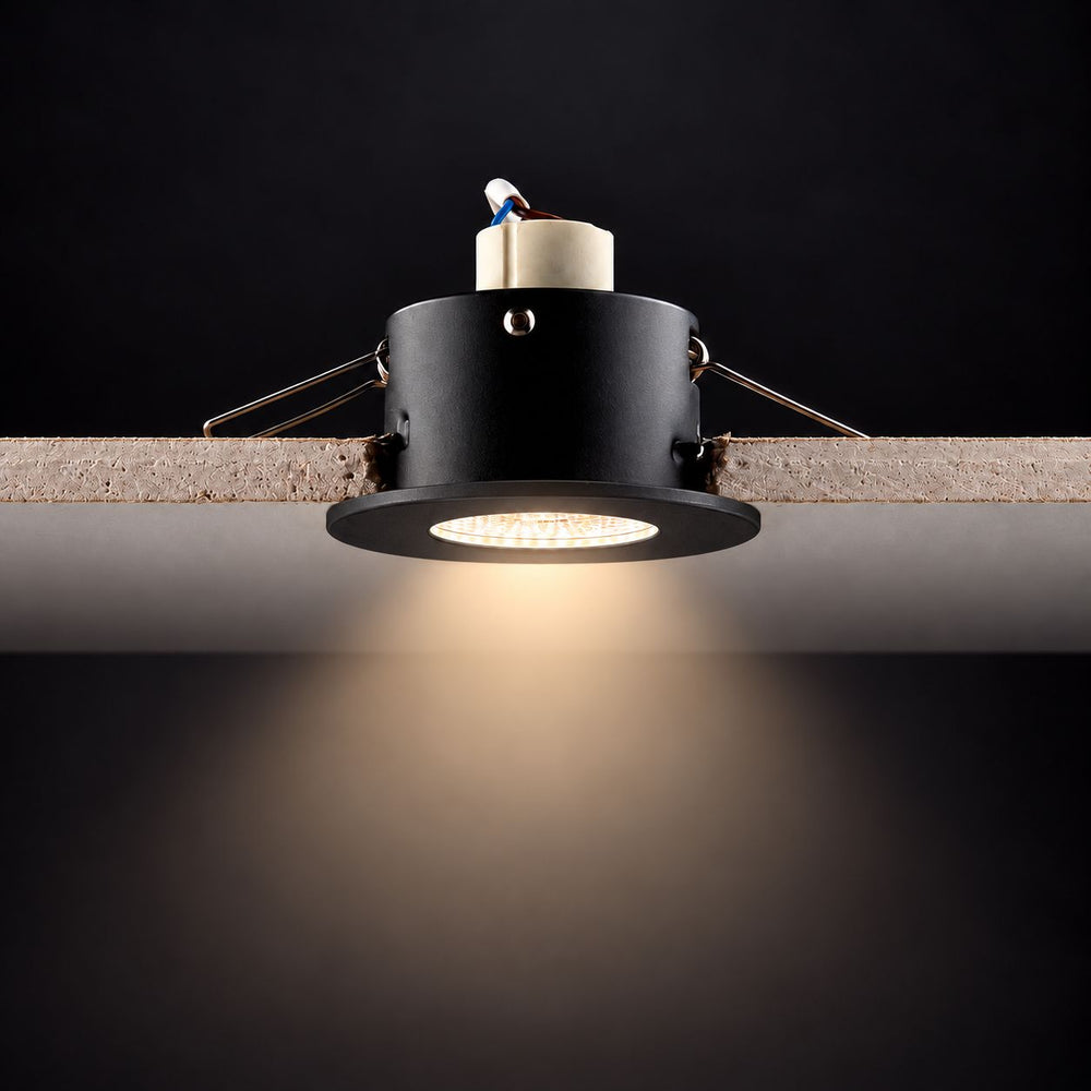 Creo Smart RGB Fire Rated Downlight — Matt Black, IP65 in a room