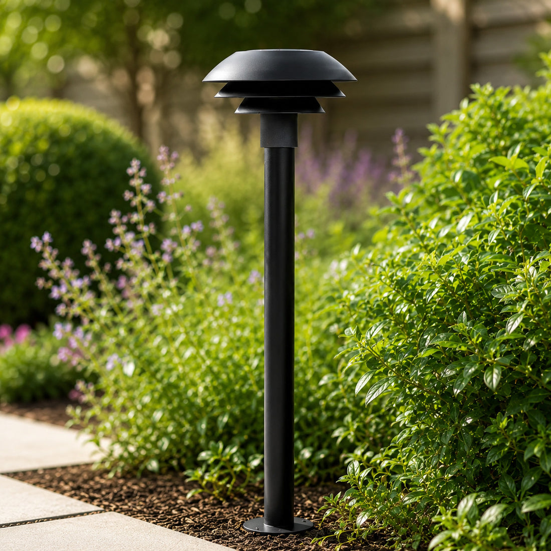 DL31 100cm pagoda path light beside catmint on a paved garden edge