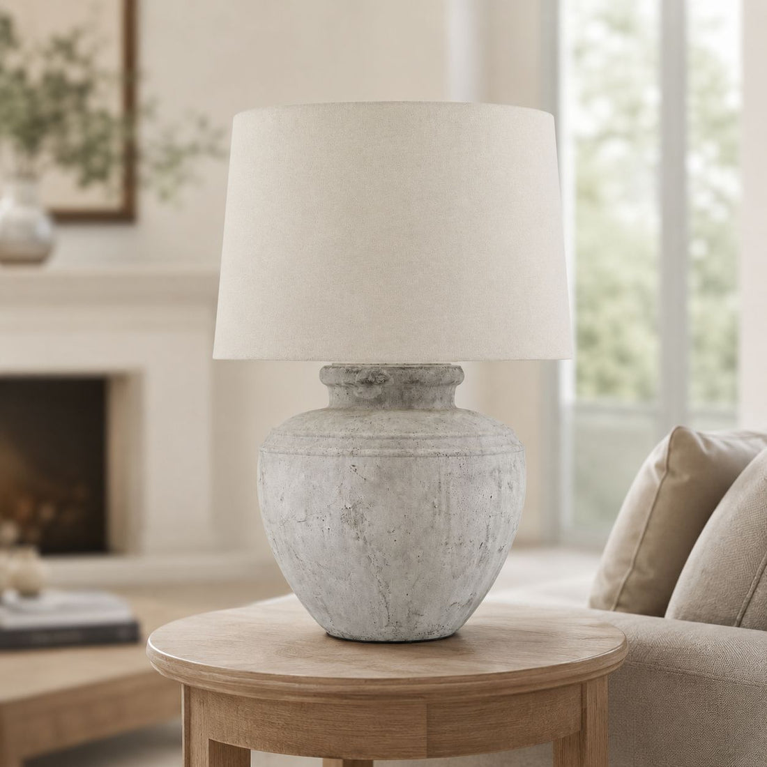 Darcy Chorus white stone table lamp with linen shade in a neutral living room