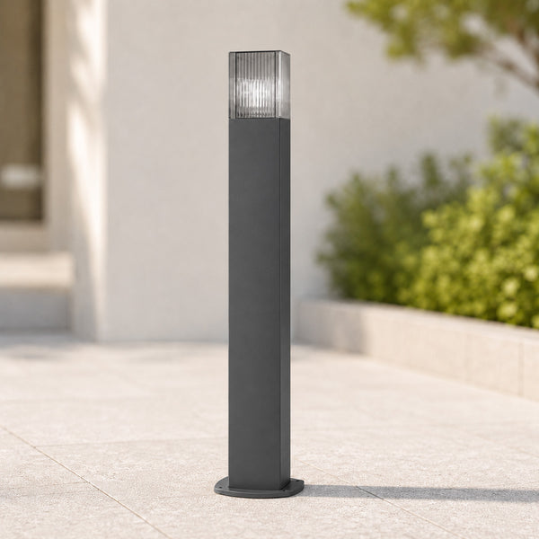Dark 75cm anthracite path bollard with ribbed diffuser on a stone patio