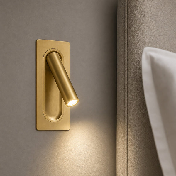Defoe recessed gold LED reading light angled from its brushed backplate