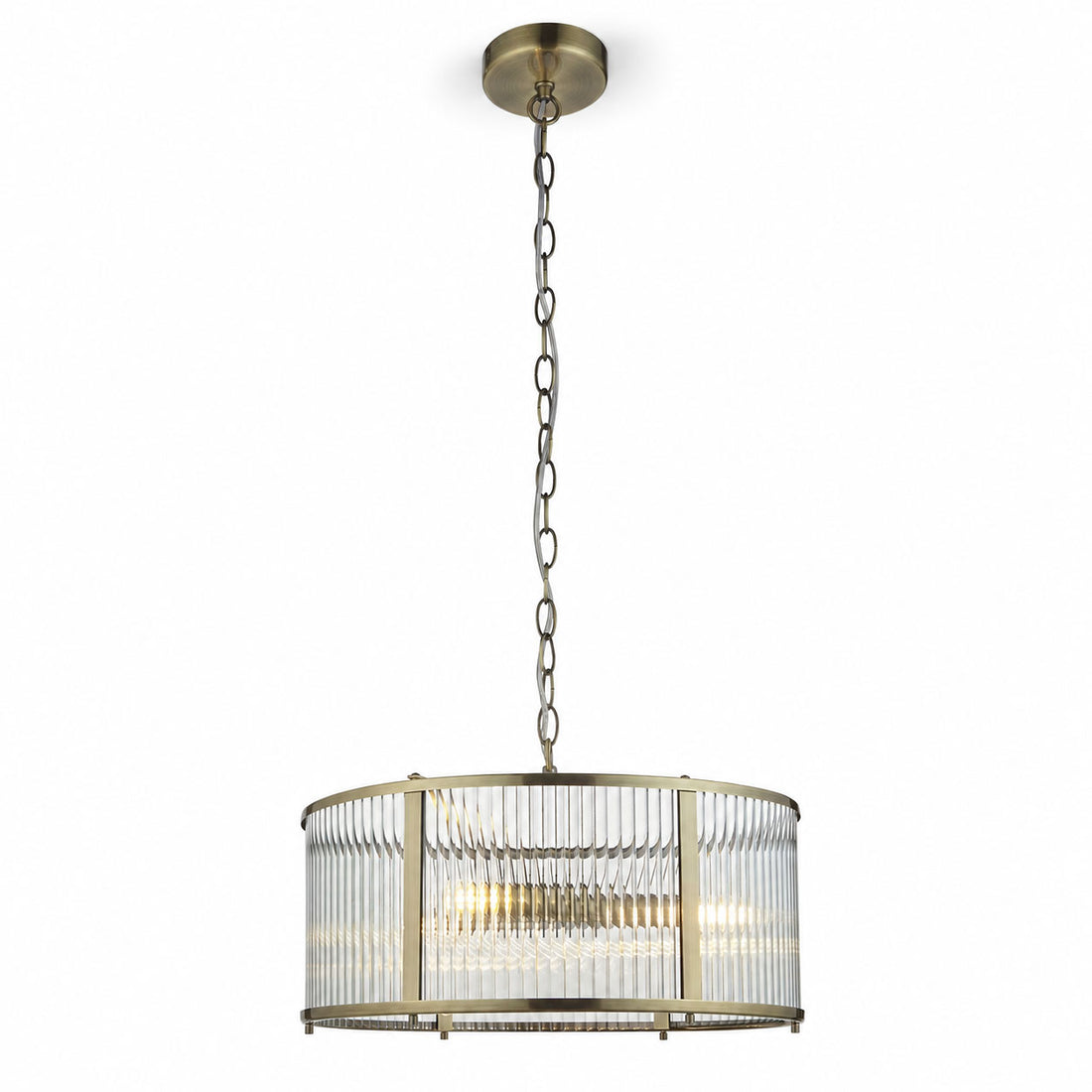 Halo 3-light ribbed glass drum pendant in antique brass on a chain, lit