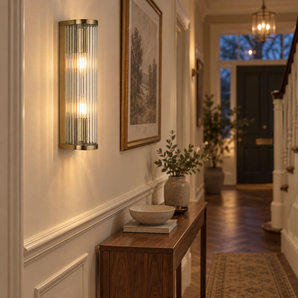 Halo 2-Light Ribbed Wall Sconce — Glass, Antique Brass in a room