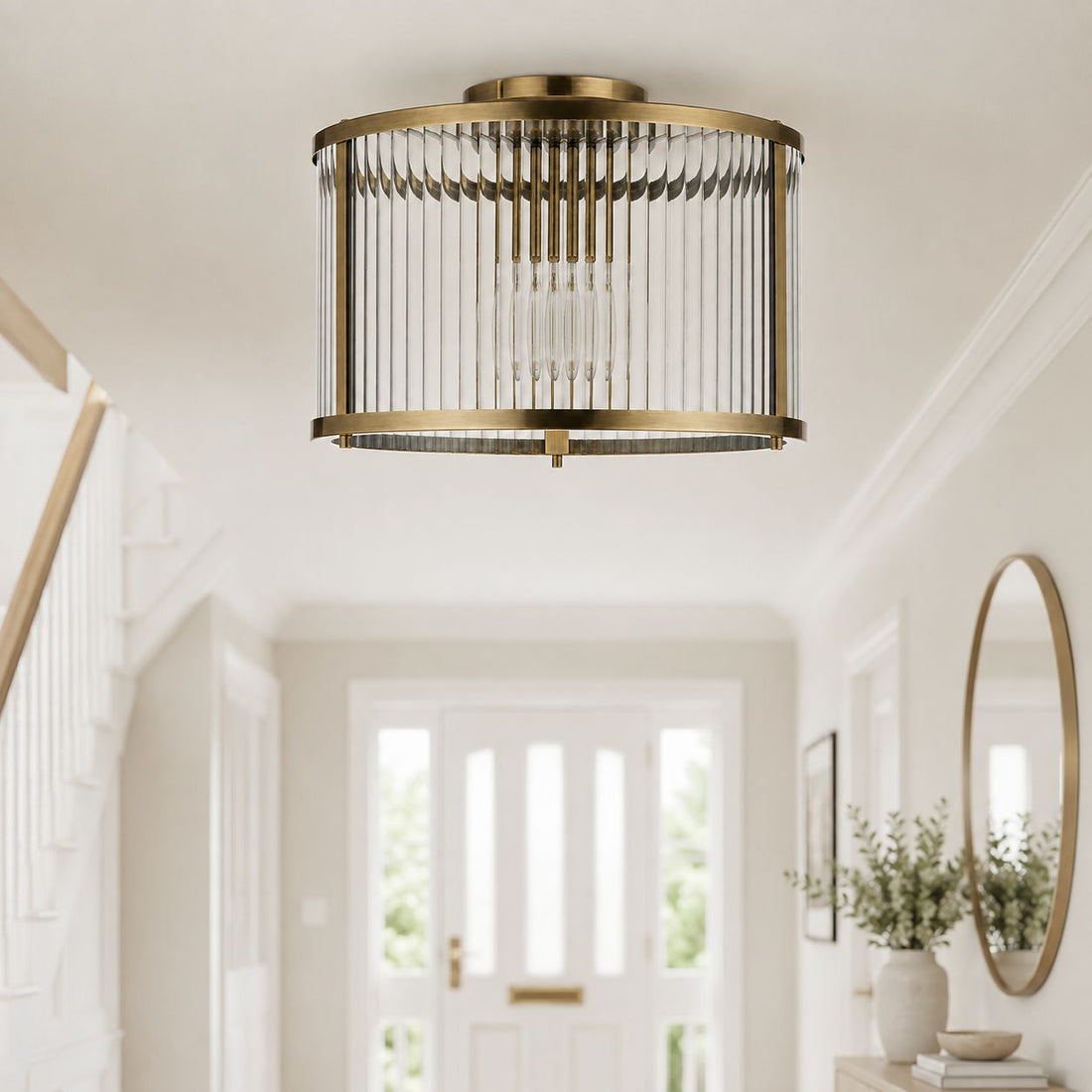 Halo flush ribbed light in antique brass on a hallway ceiling by a front door