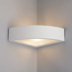 Paintable corner wall light installed on interior wall angle creating ambient glow