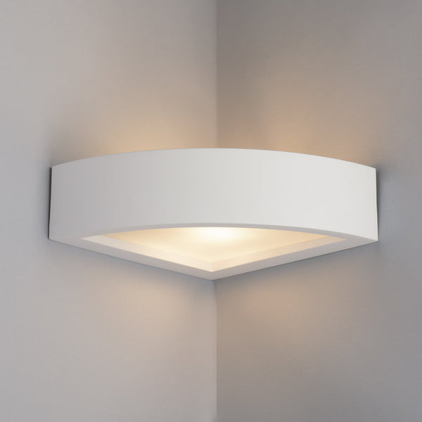 Paintable corner wall light installed on interior wall angle creating ambient glow