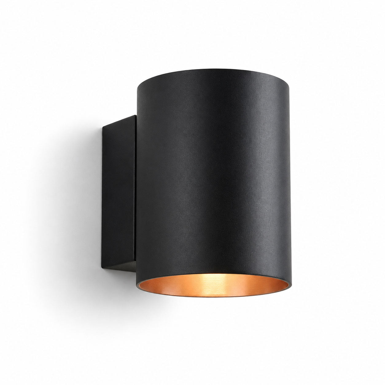 Jen round black up and down wall light with gold interior, angled view on white