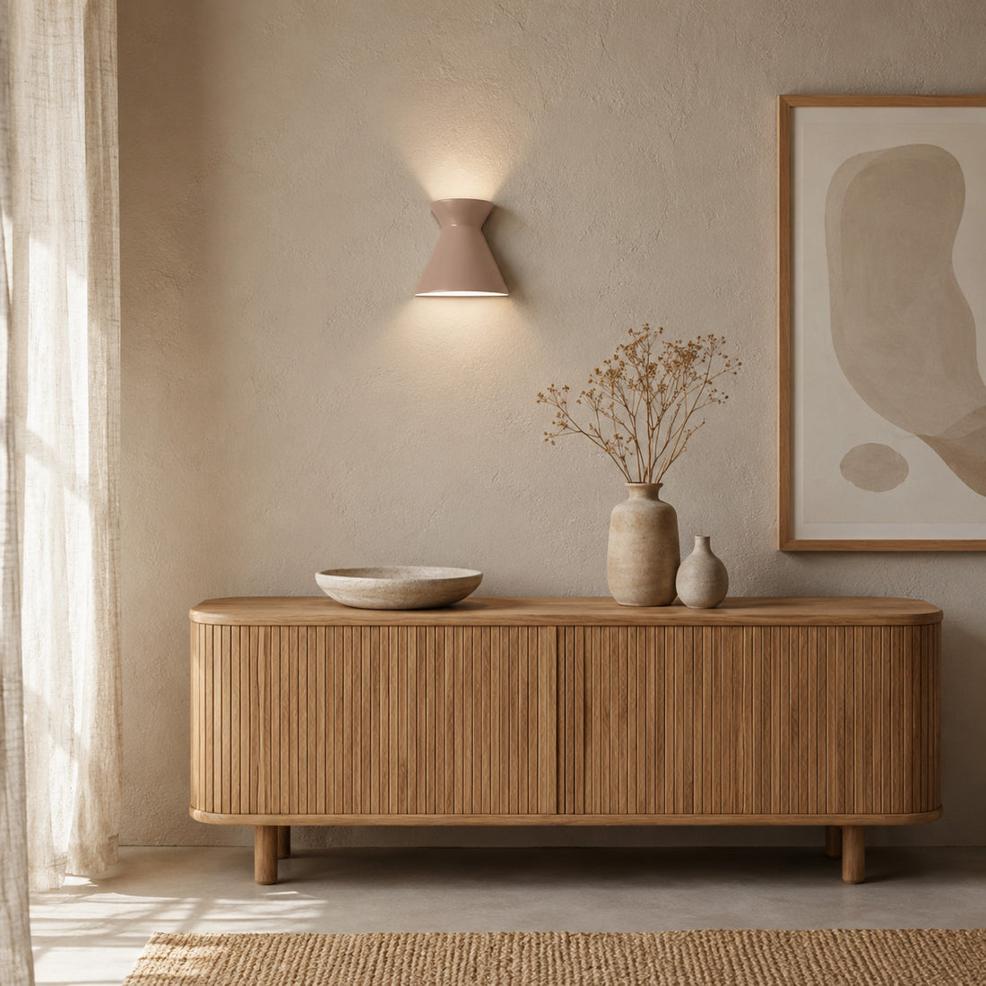 Kiro macchiato wall light glowing above an oak sideboard in soft daylight