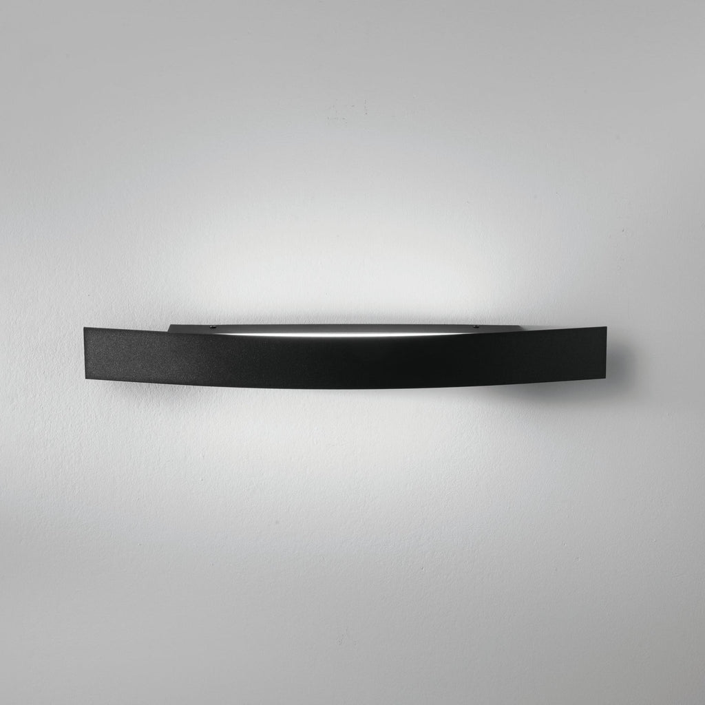 Spoiler black LED linear wall light mounted on white wall showing light wash effect