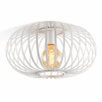 Lacena white sculptural iron cage flush ceiling light with filament bulb, angled view