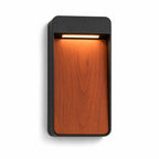 Laska anthracite outdoor LED wall light with vertical wood-effect panel, angled view on white
