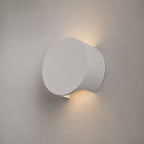 Leiron Round Wall Light — Paintable White Plaster, Up & Down
