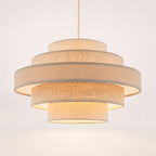 Linna oatmeal linen five-tier easy-fit pendant shade lit, angled view