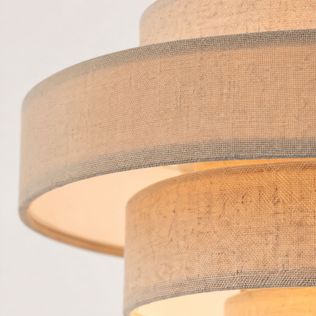 Linna oatmeal linen tiered pendant shade, close-up of the layered fabric tiers