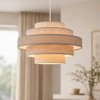 Linna five-tier linen pendant shade hanging in a white living room