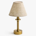 Lira brass rechargeable table lamp with oatmeal linen shade, front view