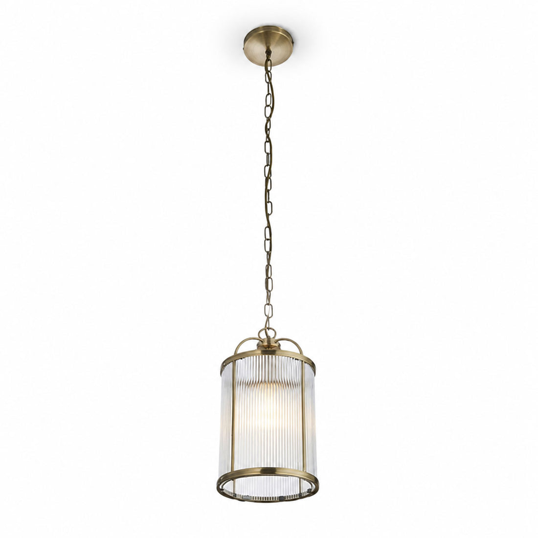Halo Petite fluted glass pendant unlit, showing brass gallery and chain