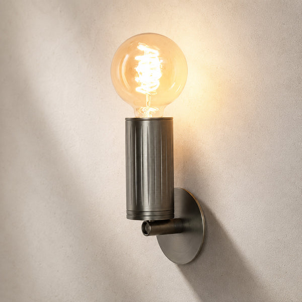 Luminar browned brass wall lamp with exposed spiral filament globe bulb, lit