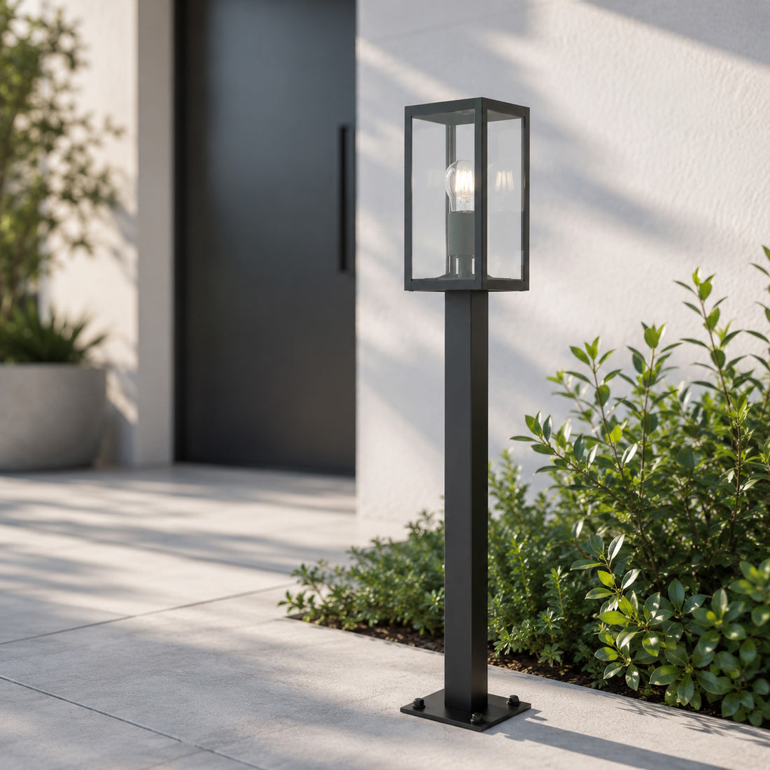 Mirage 86cm anthracite lantern path light on a paved modern driveway